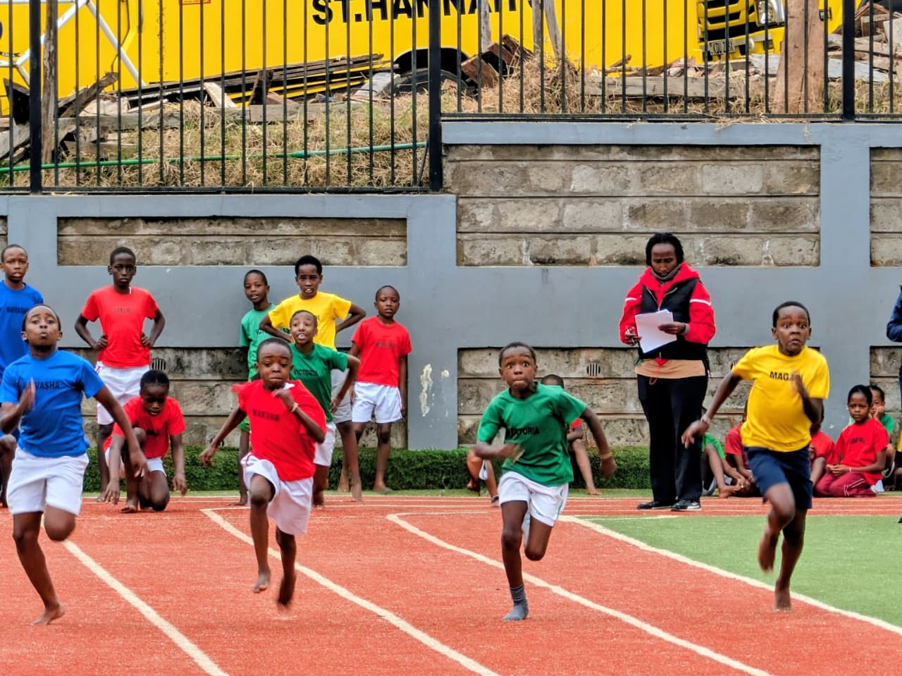 Learners racing on sports day at Runda Campus
